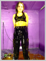  Felicity coats her black combats and sports bra in thick golden syrup featuring Felicity, the Serving Wench 