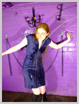  The good Sister enjoys a hosedown in a stretch denim mini-dress featuring Sister Graves, the strict one 